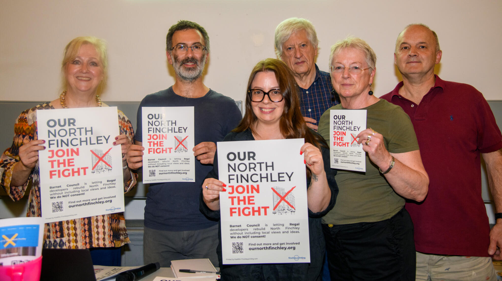 Founders of Our North Finchley Campaign a group of 6 people who founded Our North Finchley campaign. A;; are holding posters and flyers for the campaign.