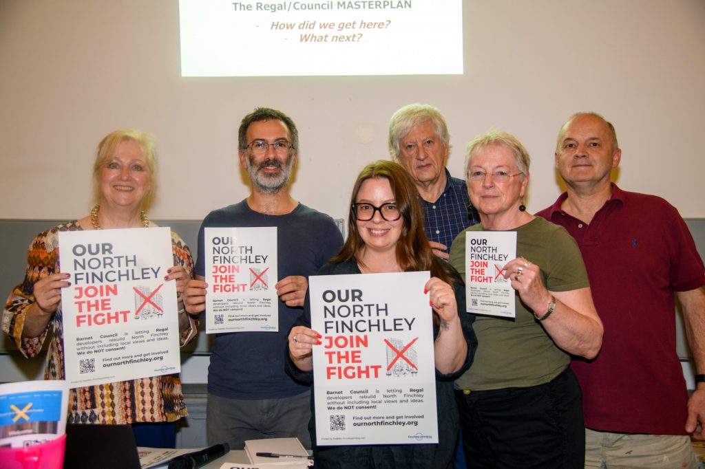 Photo of founding members holding posters and leaflets.